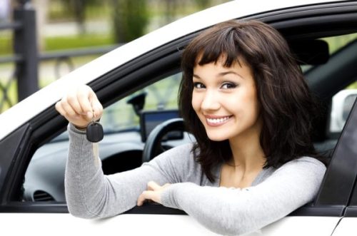 Happy Australian driver holding car keys after being approved for a bad credit car loan